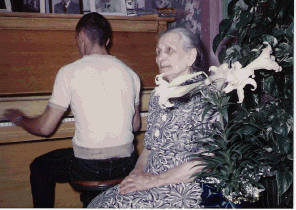 l.j. at piano with grandma laubhan.png